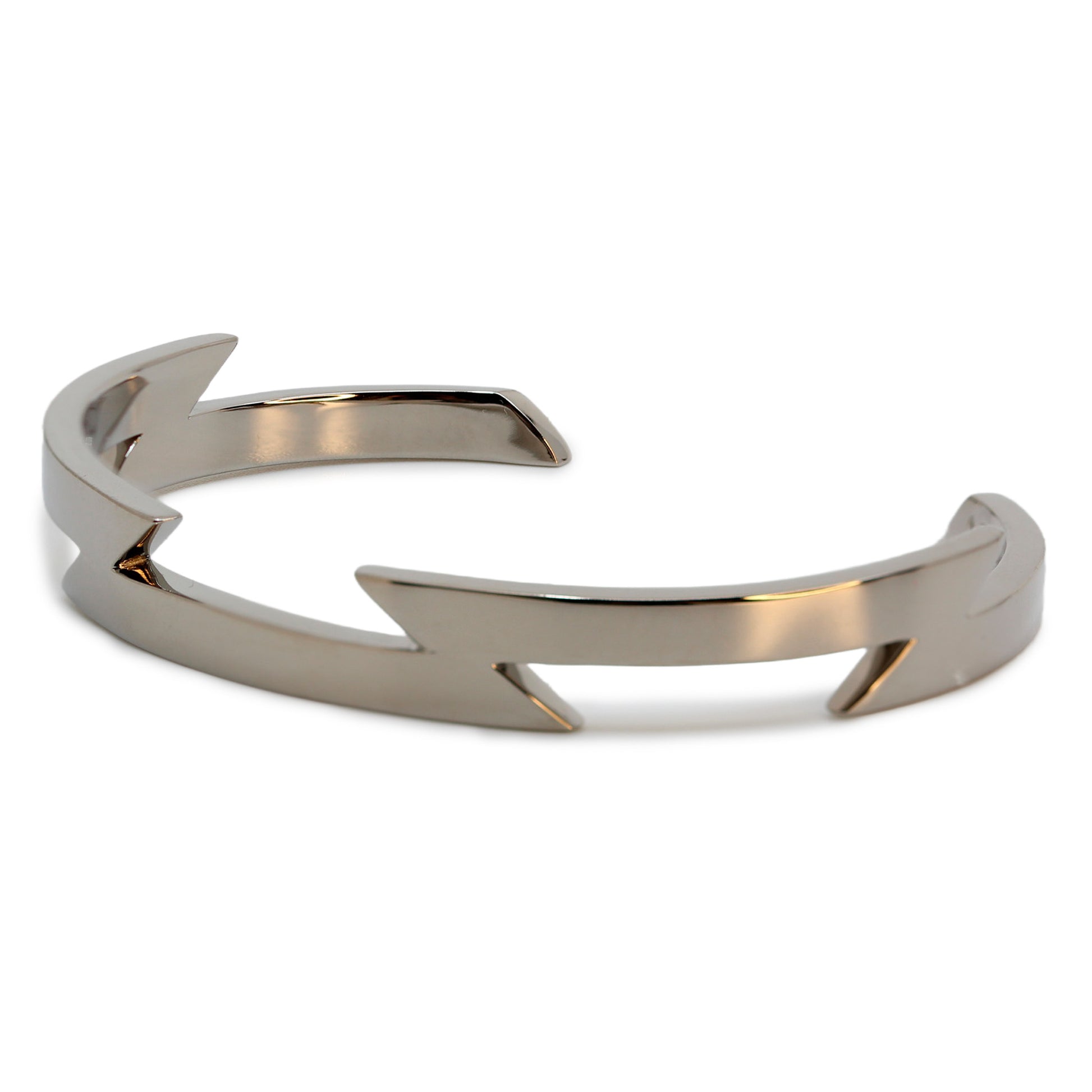 Single silver-colored titanium bangle with zig-zag pattern, 1 cm thick. Image shows corner view of bangle.
