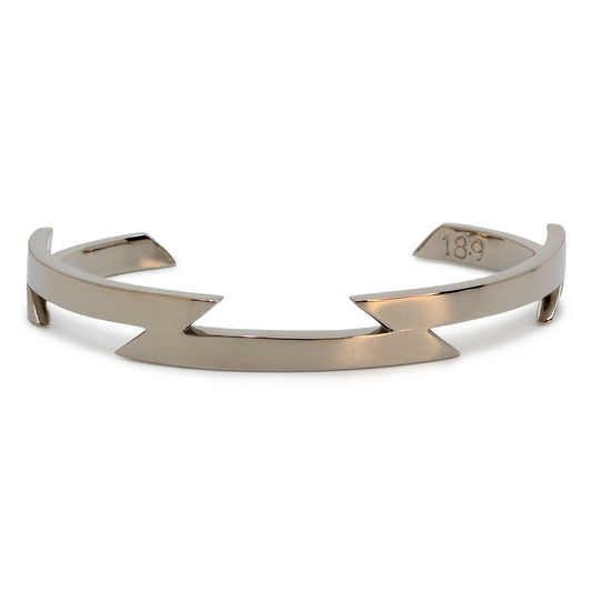 Single silver-colored titanium bangle with zig-zag pattern, 1 cm thick. Image shows front view of bangle.