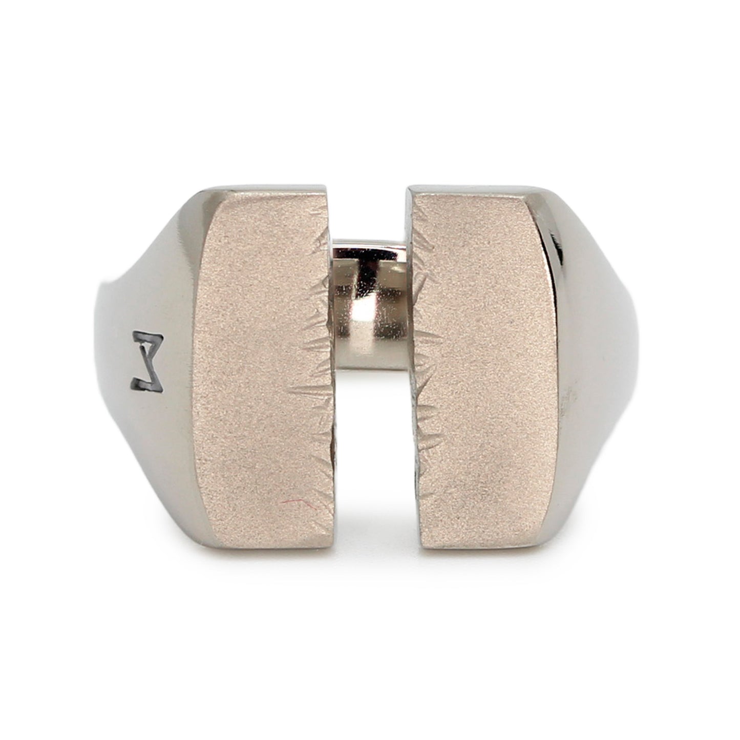 Single silver-colored titanium signet ring, 15x15 mm wide surface which has been cut through the middle. Image shows front view of the ring