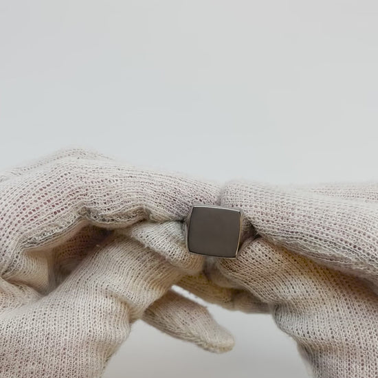 Showing all angles of a single silver-colored titanium signet ring, 15x15 mm wide surface.